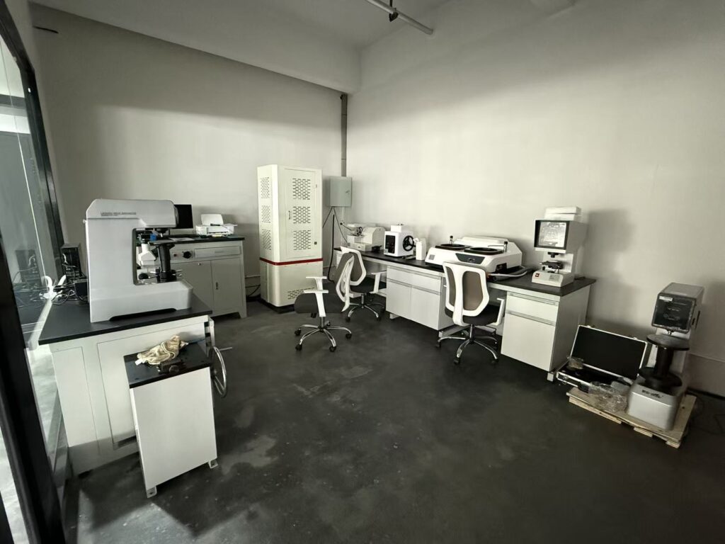 BAUTU in-house materials lab with metallographic microscope, tensile tester and hardness testers