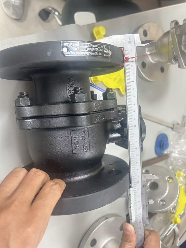 Face-to-face length of a ball valve checked with a caliper