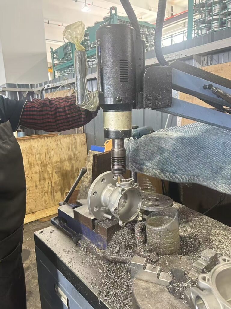 Drilling the flange bolt holes of a ball valve body